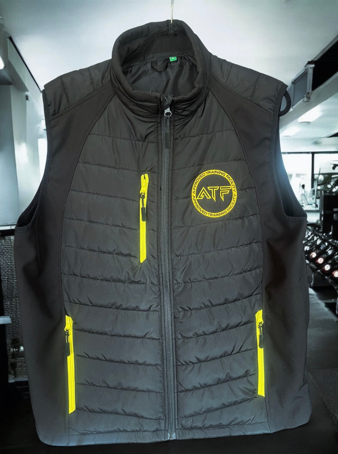 Stay warm without compromising on movement with the ATF Body Warmer. Designed for athletes and gym-goers, this lightweight yet insulated vest provides the perfect balance of warmth and flexibility.