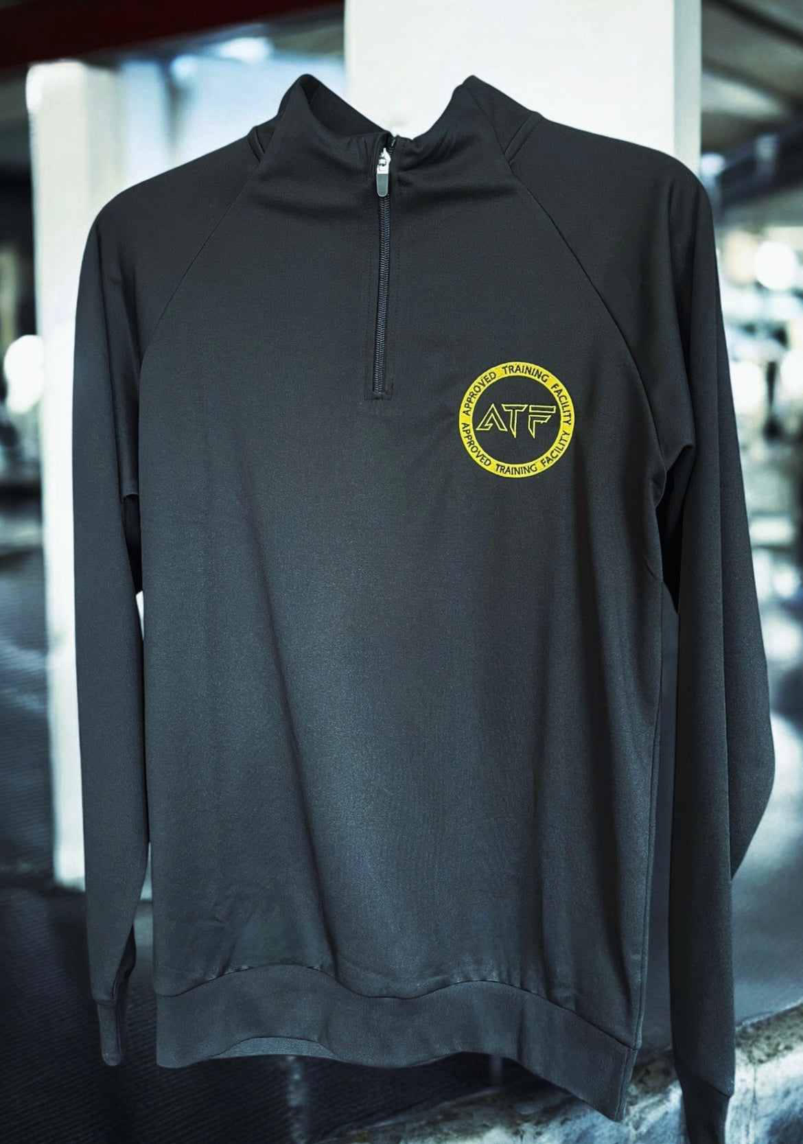 Stay sharp and comfortable with the ATF Black Half-Zip Performance Top. Designed for training and everyday wear, this sleek and functional top is made from breathable fabric to keep you cool and dry.