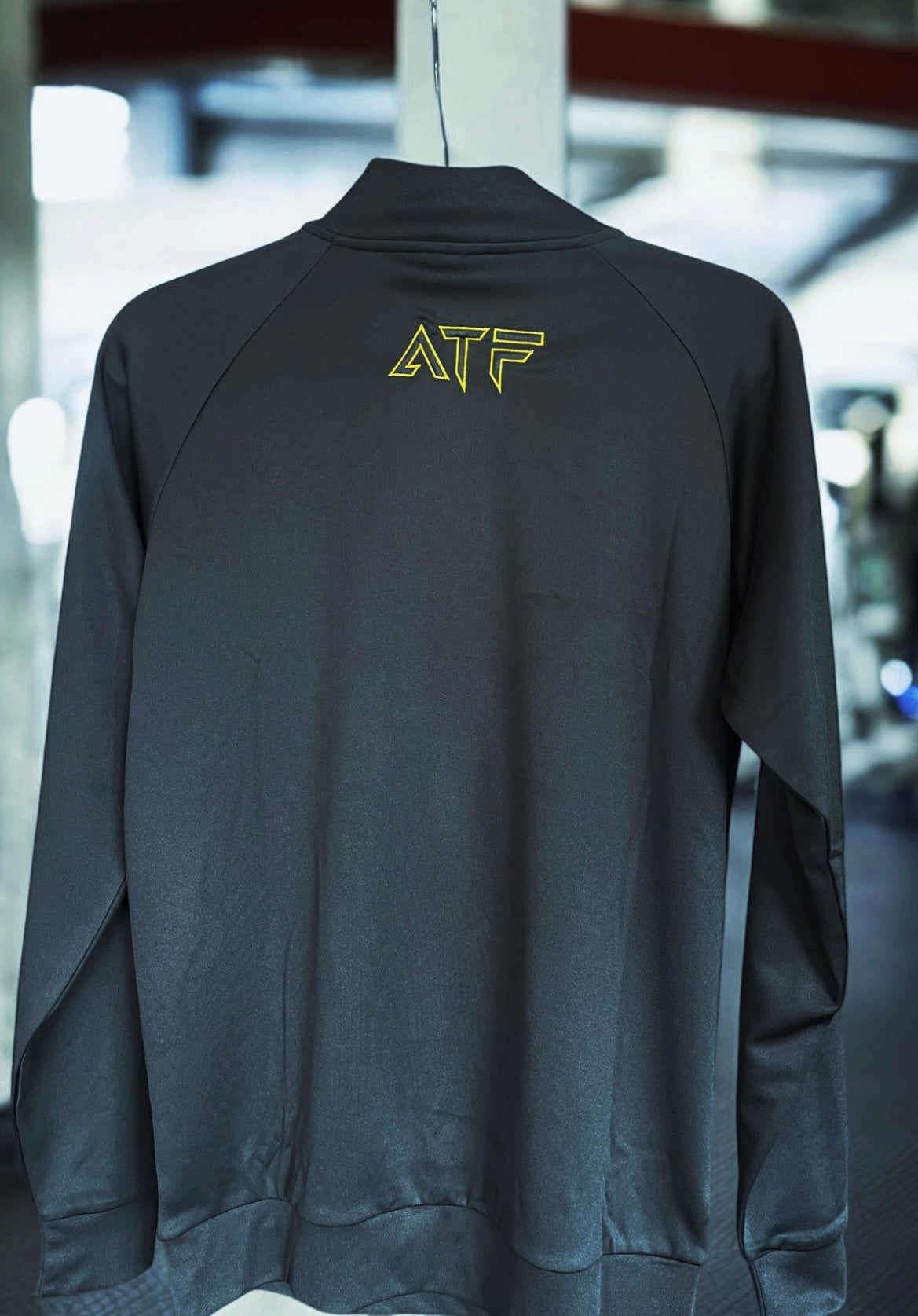 Stay sharp and comfortable with the ATF Black Half-Zip Performance Top. Designed for training and everyday wear, this sleek and functional top is made from breathable fabric to keep you cool and dry.