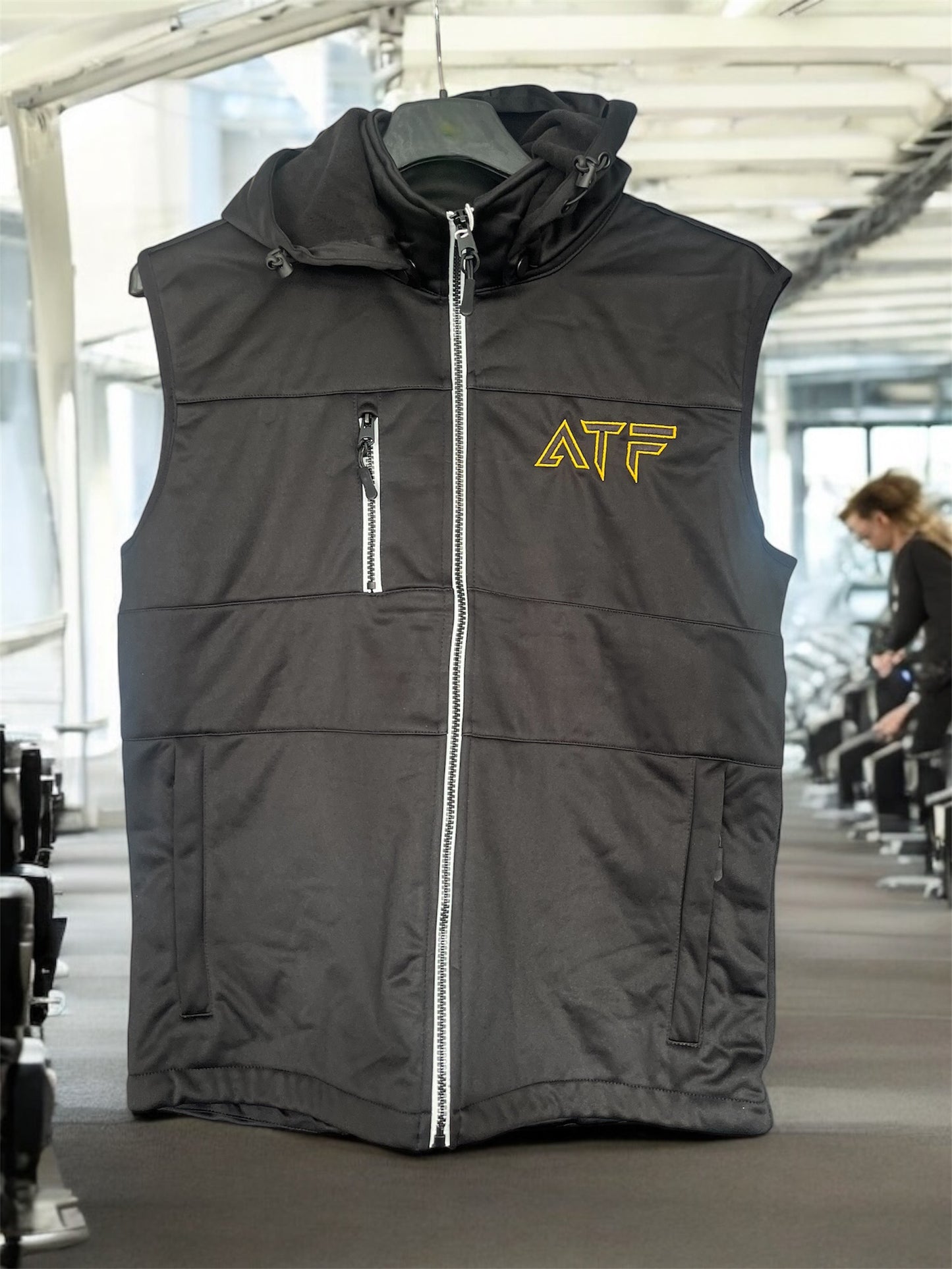 Stay warm without compromising on movement with the ATF Bodywarmer. Designed for athletes and gym-goers, this lightweight yet insulated vest provides the perfect balance of warmth and flexibility. Featuring a sleek design with ATF logo, it's ideal for layering your gym gear or wearing casually.