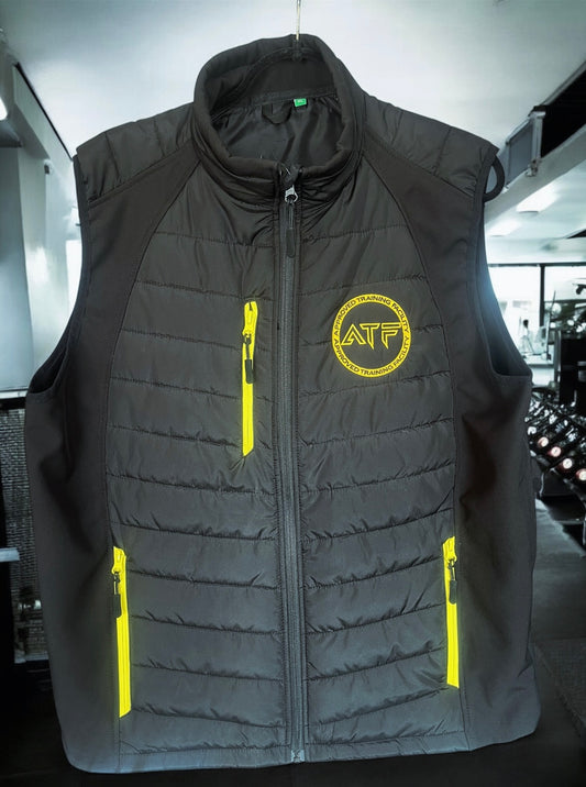 Stay warm without compromising on movement with the ATF Body Warmer. Designed for athletes and gym-goers, this lightweight yet insulated vest provides the perfect balance of warmth and flexibility.