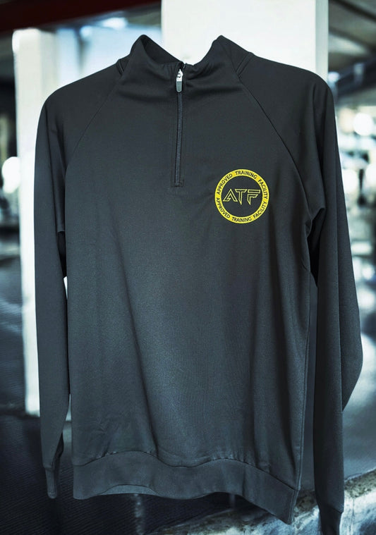 Stay sharp and comfortable with the ATF Black Half-Zip Performance Top. Designed for training and everyday wear, this sleek and functional top is made from breathable fabric to keep you cool and dry.