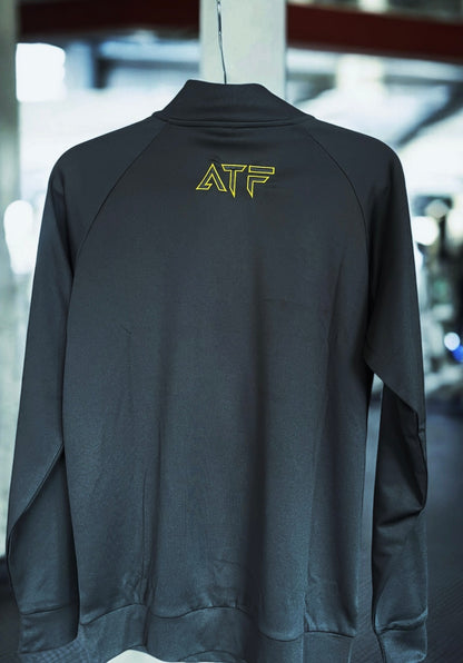 Stay sharp and comfortable with the ATF Black Half-Zip Performance Top. Designed for training and everyday wear, this sleek and functional top is made from breathable fabric to keep you cool and dry.